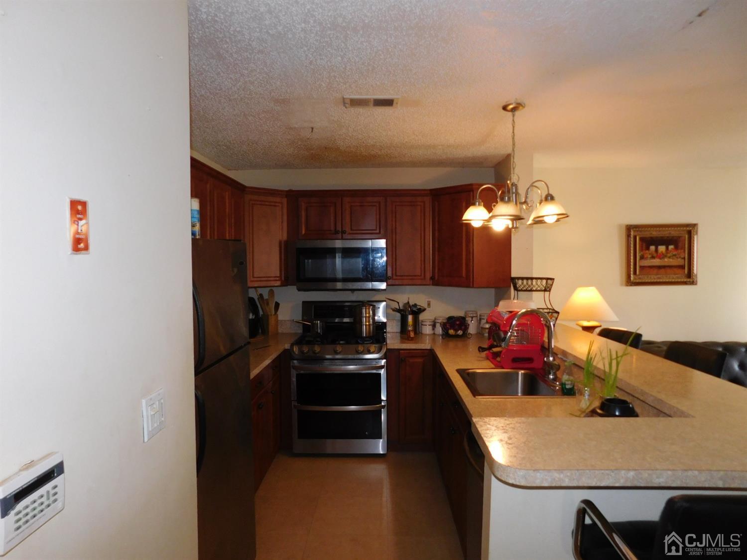 723 Edpas Road New Brunswick, NJ 08901 - Photo 5 of 20 a kitchen with a sink appliances and cabinets
