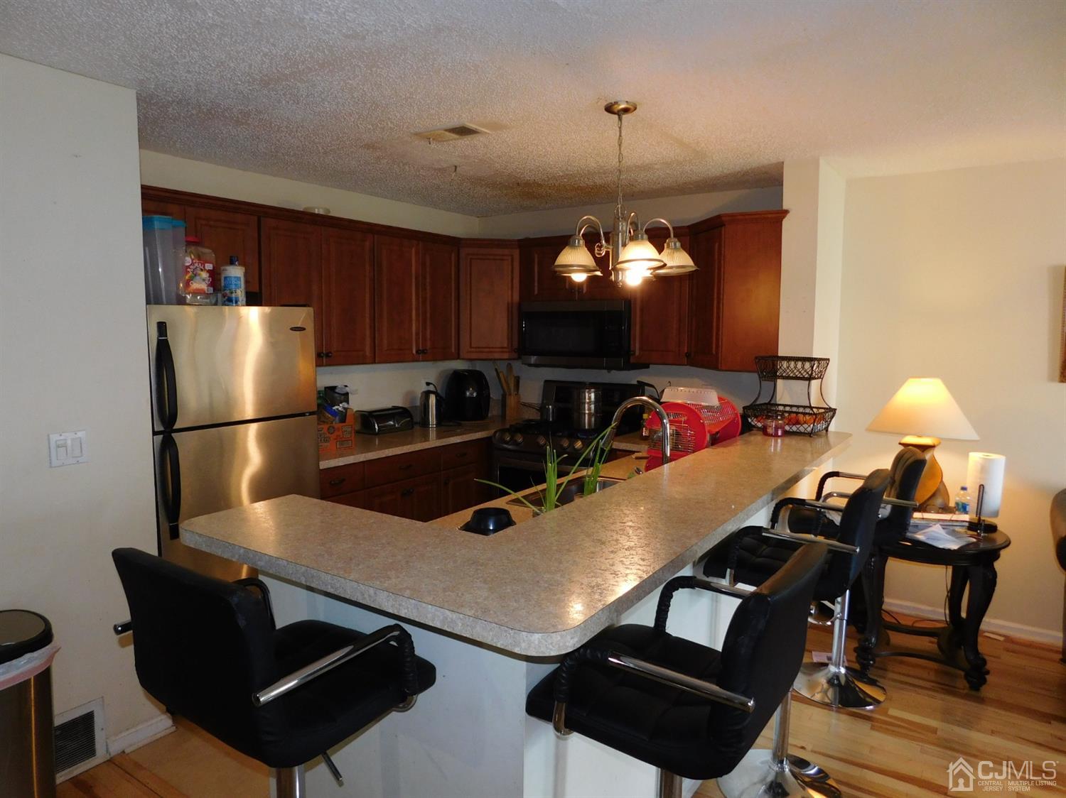 723 Edpas Road New Brunswick, NJ 08901 - Photo 6 of 20 a room with furniture and a chandelier