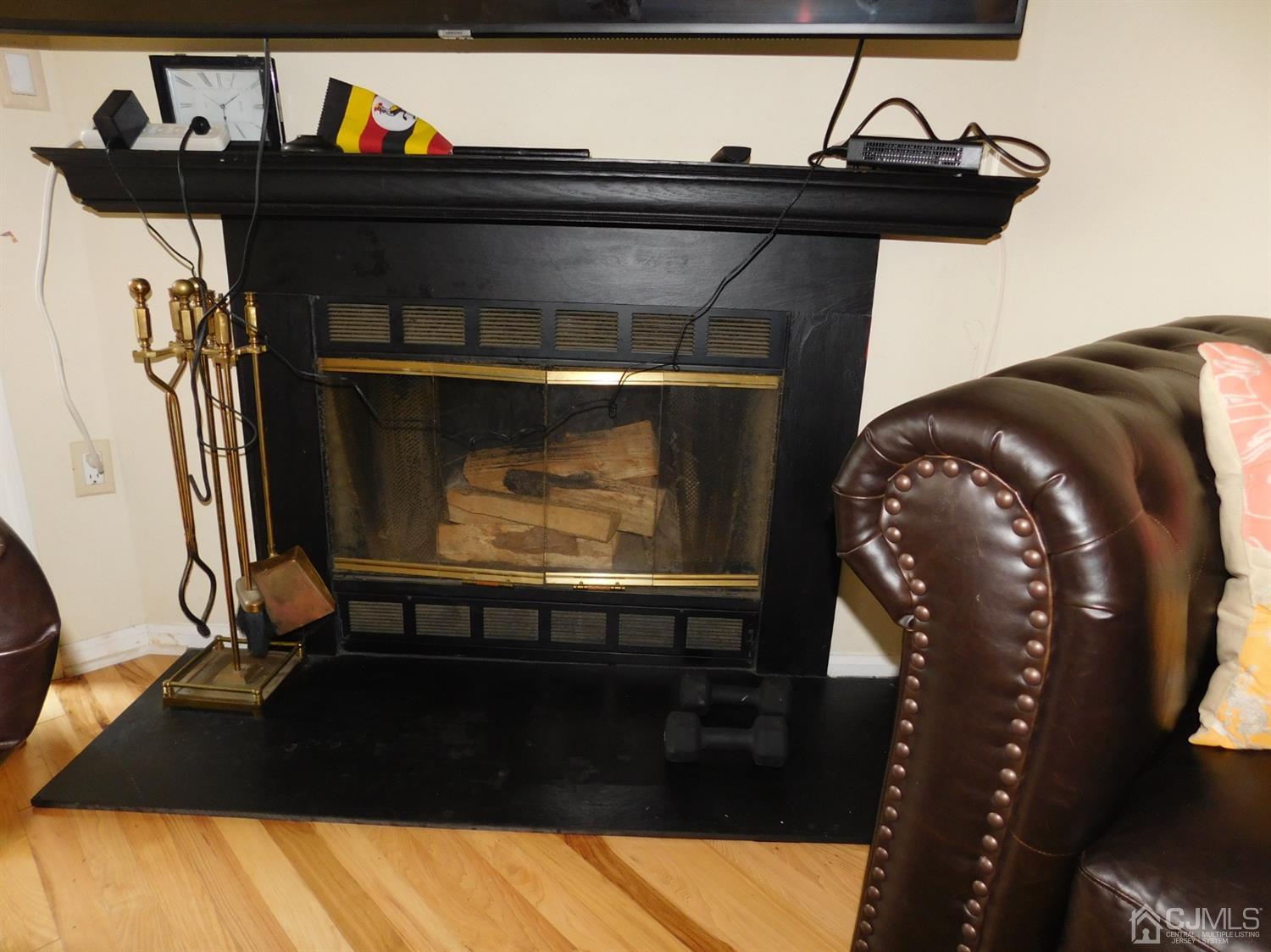 723 Edpas Road New Brunswick, NJ 08901 - Photo 8 of 20 a living room with furniture and a fireplace