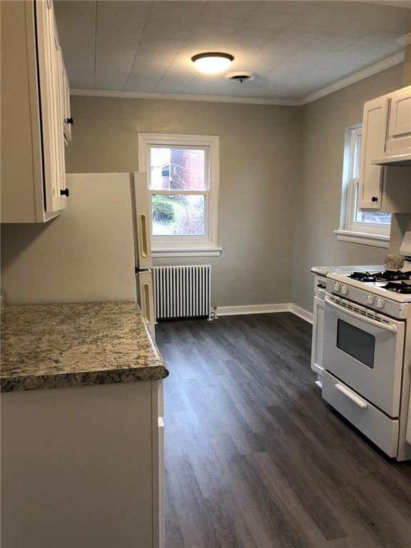 5450 Covode Place Pittsburgh, PA 15217 - Photo 11 of 25 a kitchen with stainless steel appliances granite countertop a stove a sink and a microwave