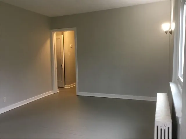 a view of hallway with an empty room