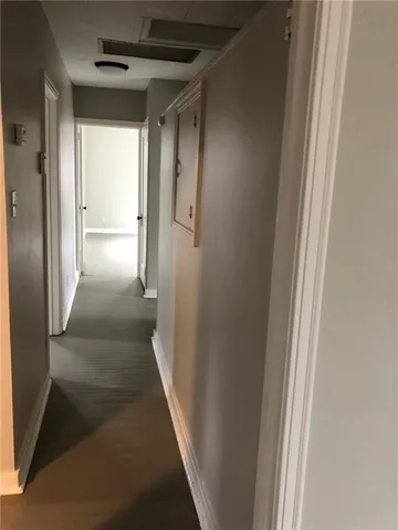 a bathroom with a sink a toilet and shower curtain