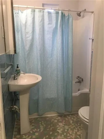 a view of a hallway with windows