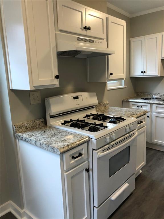 5450 Covode Place Pittsburgh, PA 15217 - Photo 5 of 25 a kitchen with granite countertop a stove and a sink
