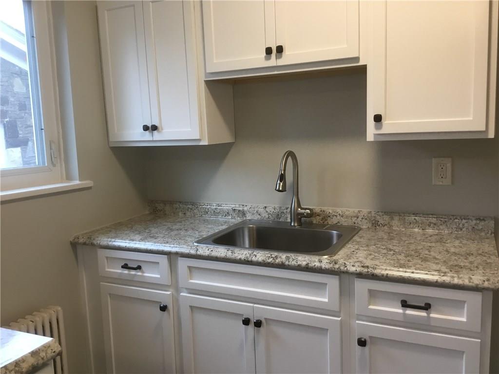5450 Covode Place Pittsburgh, PA 15217 - Photo 8 of 25 a kitchen with a sink and cabinets