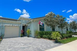 14531 Bretton Woods Trace Delray Beach, FL 33446 - Photo 1 of 57 a view of a house with a yard and potted plants