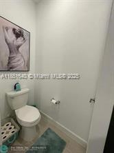 14531 Bretton Woods Trace Delray Beach, FL 33446 - Photo 12 of 57 a toilet sitting next to a white sink and vanity