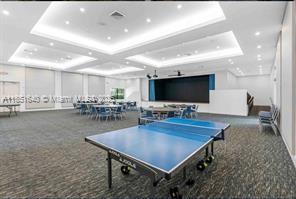 14531 Bretton Woods Trace Delray Beach, FL 33446 - Photo 46 of 57 a living room with furniture and a flat screen tv