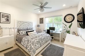 14531 Bretton Woods Trace Delray Beach, FL 33446 - Photo 7 of 57 a bedroom with a bed a clock and a large window