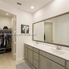 14531 Bretton Woods Trace Delray Beach, FL 33446 - Photo 9 of 57 a bathroom with a sink and a mirror