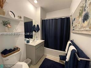 14531 Bretton Woods Trace Delray Beach, FL 33446 - Photo 10 of 57 a bathroom with a sink toilet and shower