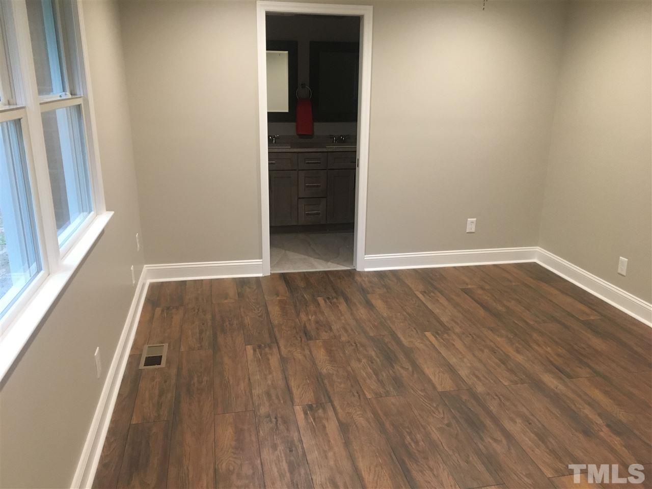 932 Bluestone Road Durham, NC 27713 - Photo 8 of 18 All new windows, walk-in closet, new lighting and fan.