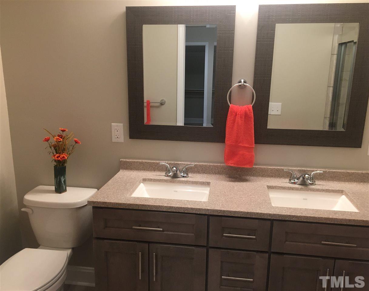 932 Bluestone Road Durham, NC 27713 - Photo 10 of 18 Beautiful master bathroom with tile shower, tile floor, and double vanity.