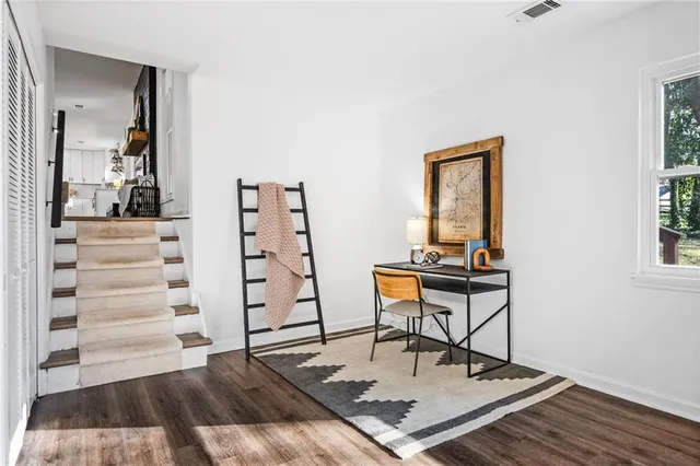 a work room with furniture and wooden floor