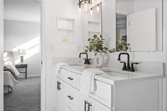 a bathroom with a sink and a mirror