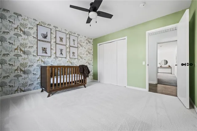 a bedroom with a bed and a bathroom