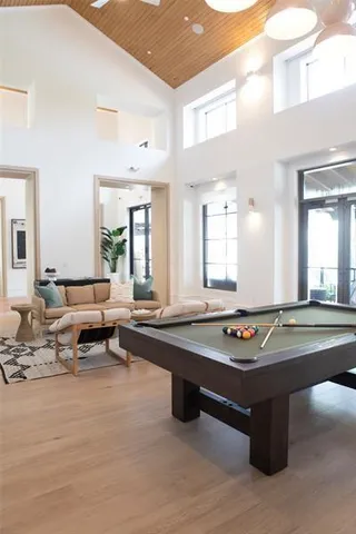 a living room with granite countertop furniture and floor to ceiling window