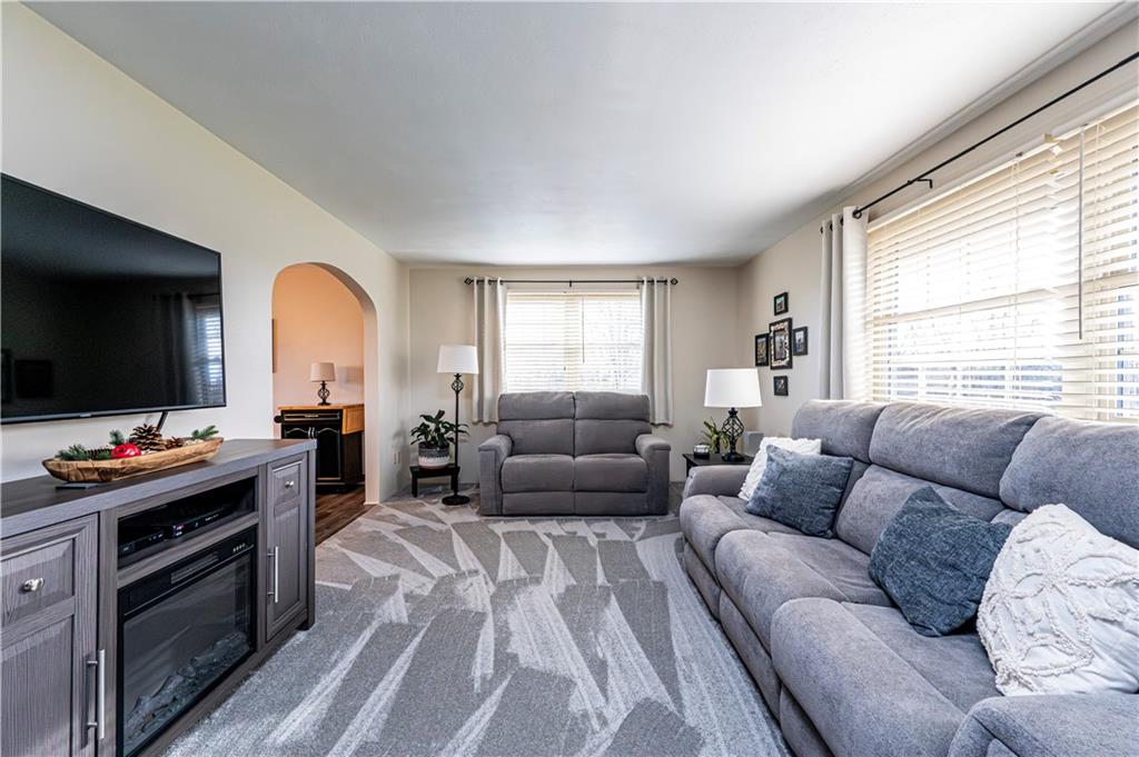 108 Stewart Road Derry, PA 15627 - Photo 11 of 30 a living room with furniture and a flat screen tv
