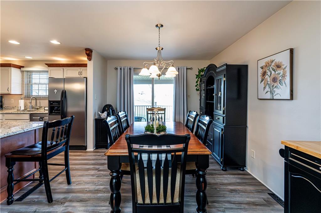 108 Stewart Road Derry, PA 15627 - Photo 16 of 30 a view of a dining room with furniture window and wooden floor