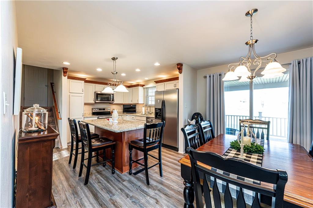 108 Stewart Road Derry, PA 15627 - Photo 17 of 30 a dining room with furniture and wooden floor