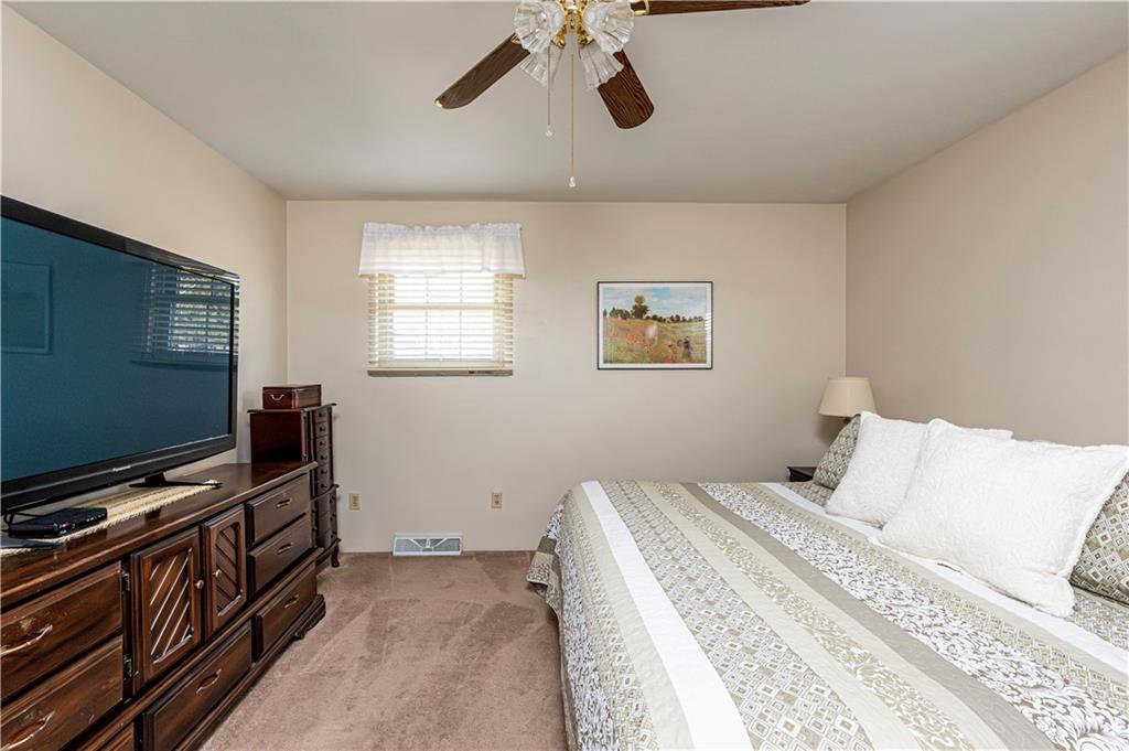 108 Stewart Road Derry, PA 15627 - Photo 21 of 30 a bedroom with a bed and a flat screen tv