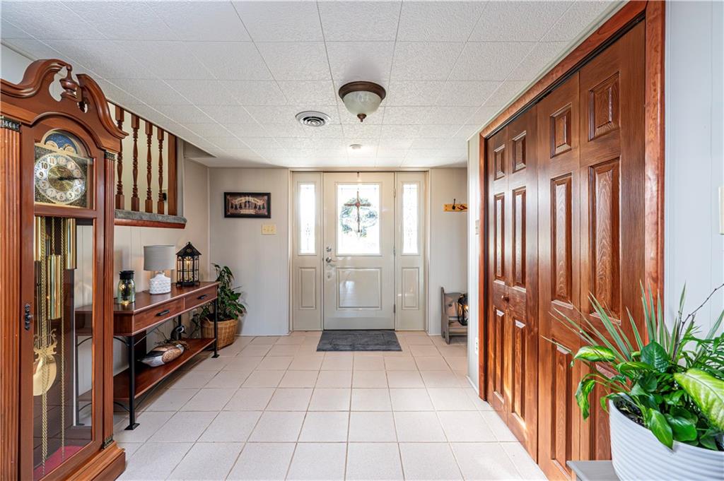 108 Stewart Road Derry, PA 15627 - Photo 6 of 30 a view of a hallway to dining room and chandelier