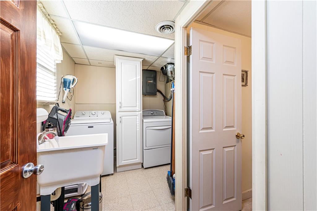 108 Stewart Road Derry, PA 15627 - Photo 9 of 30 a storage room with washer and dryer