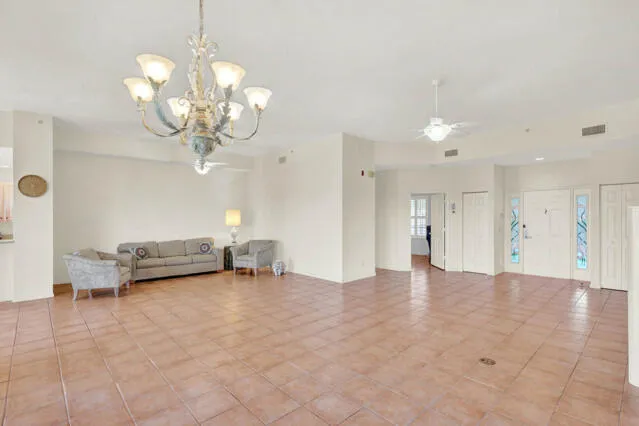 a kitchen with a refrigerator sink and cabinets