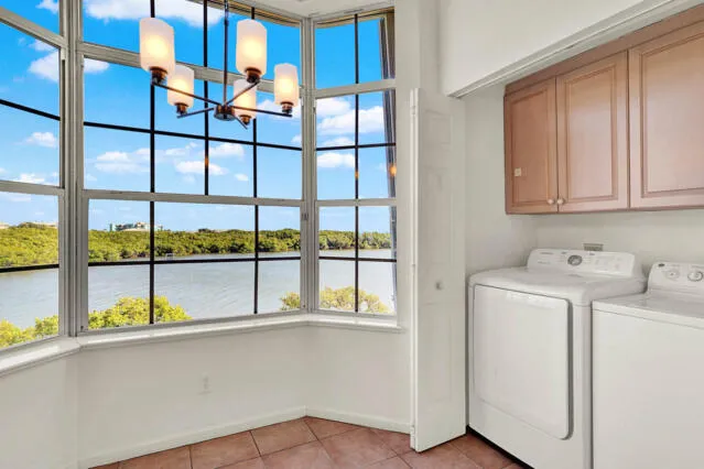 a spacious bathroom with a double vanity sink mirror and toilet