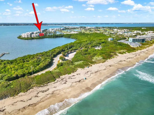 a view of a lake with houses in the back