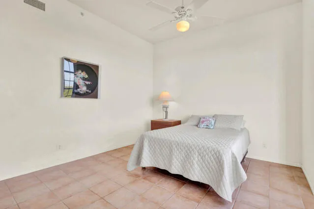 a bedroom with two beds and painted walls