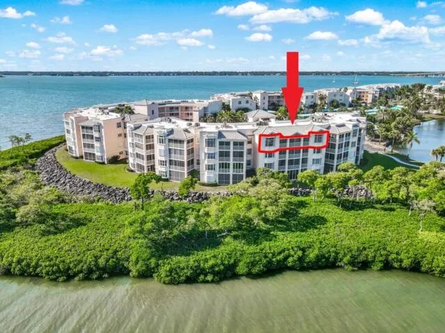 a view of a kitchen with a sink cabinets and wooden floor