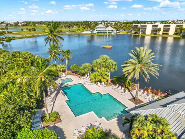 a view of a lake with a house in the background