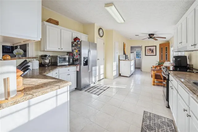 a bedroom with a bed a desk and chair