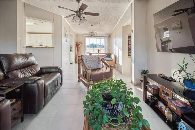 a spacious bathroom with a granite countertop sink and a mirror