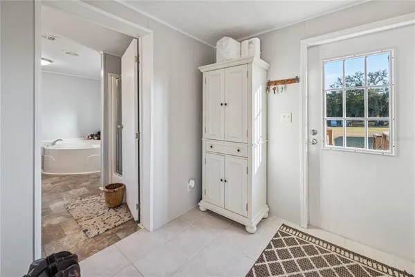 a spacious bathroom with a granite countertop sink and a mirror