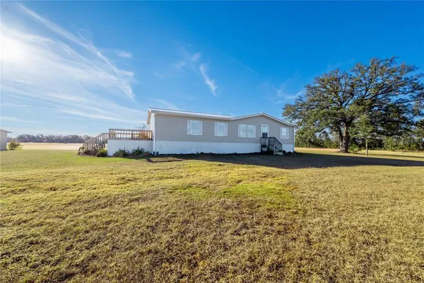 a house view with a garden space