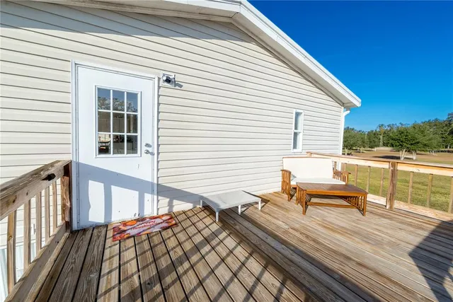 a kitchen with granite countertop a sink a stove and cabinets