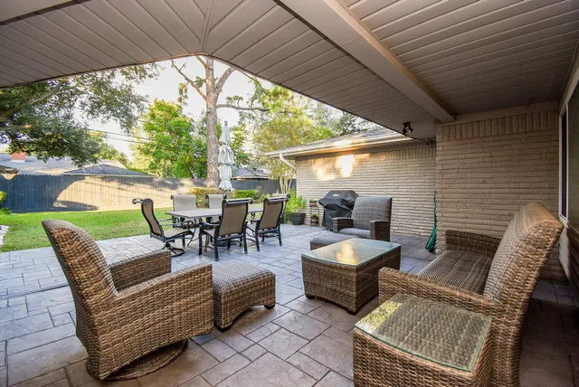 a view of a patio with couches table and chairs