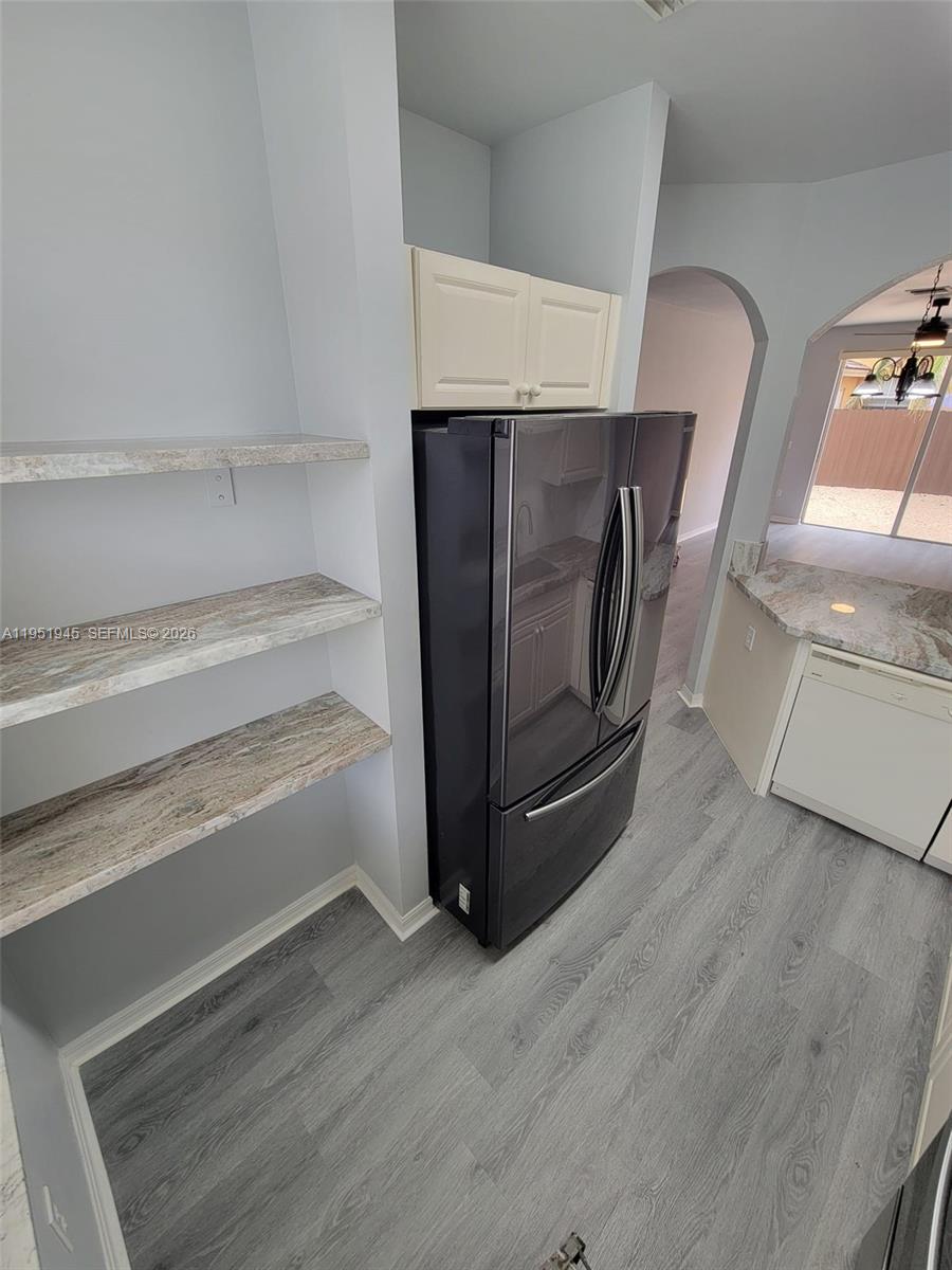 751 Southeast 2nd Street Homestead, FL 33030 - Photo 13 of 18 a view of a room with wooden floor and cabinet
