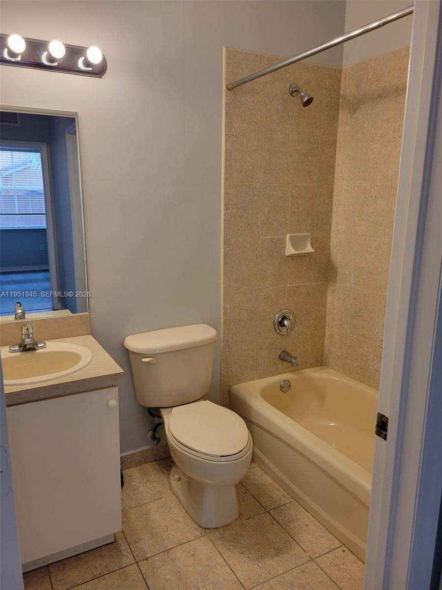 751 Southeast 2nd Street Homestead, FL 33030 - Photo 14 of 18 a bathroom with a toilet sink and shower