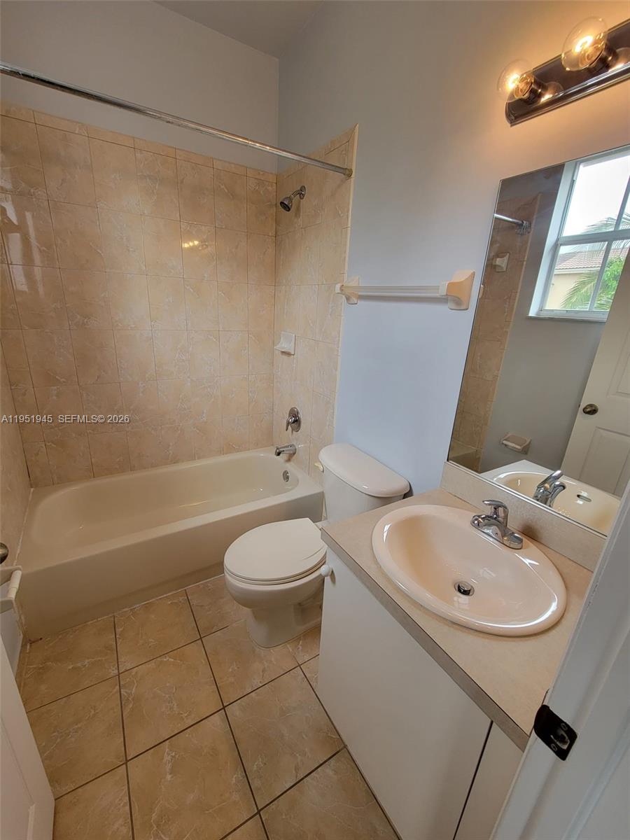 751 Southeast 2nd Street Homestead, FL 33030 - Photo 15 of 18 a bathroom with a sink a toilet and shower