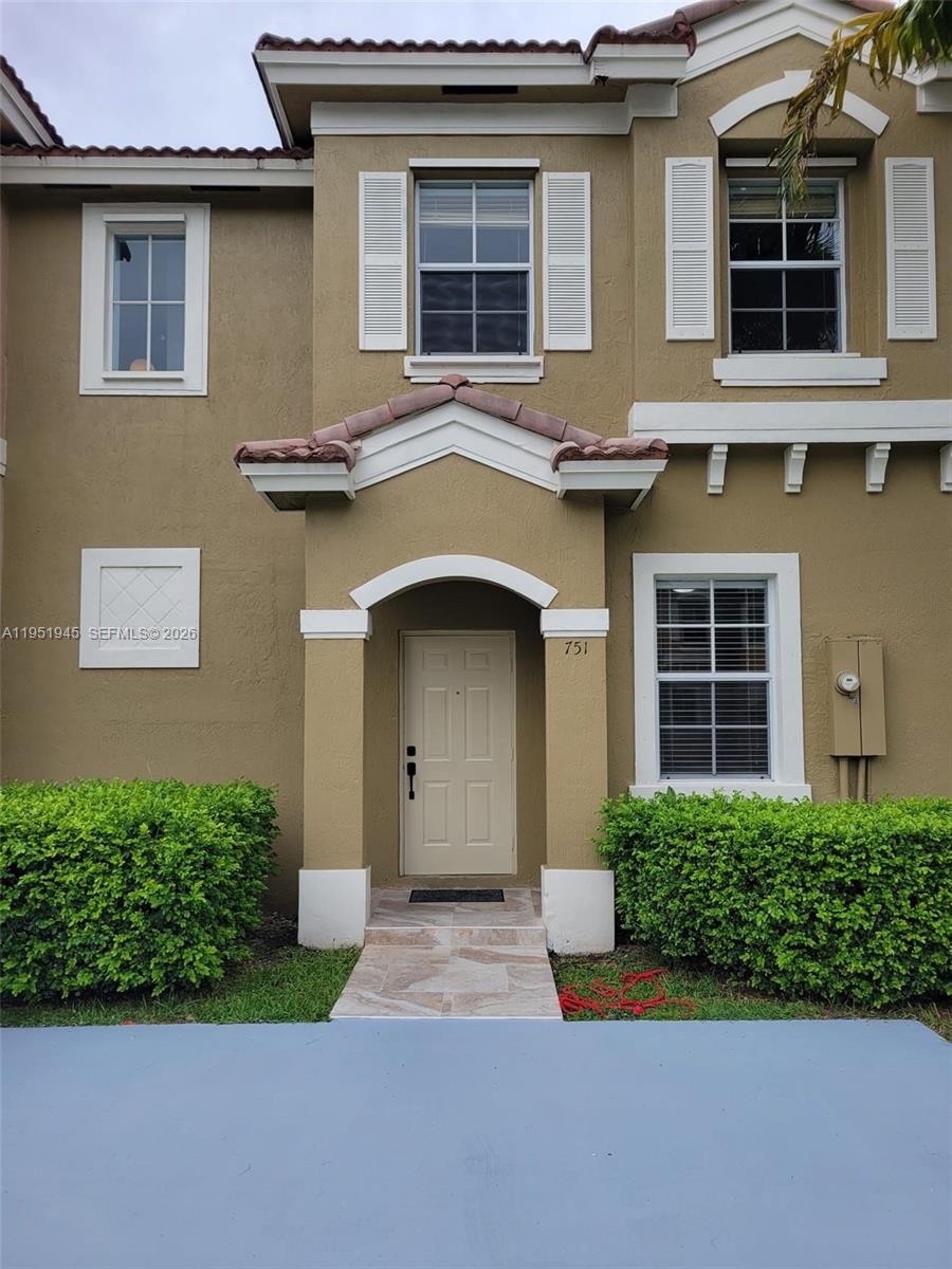 751 Southeast 2nd Street Homestead, FL 33030 - Photo 5 of 18 a front view of a house with garden