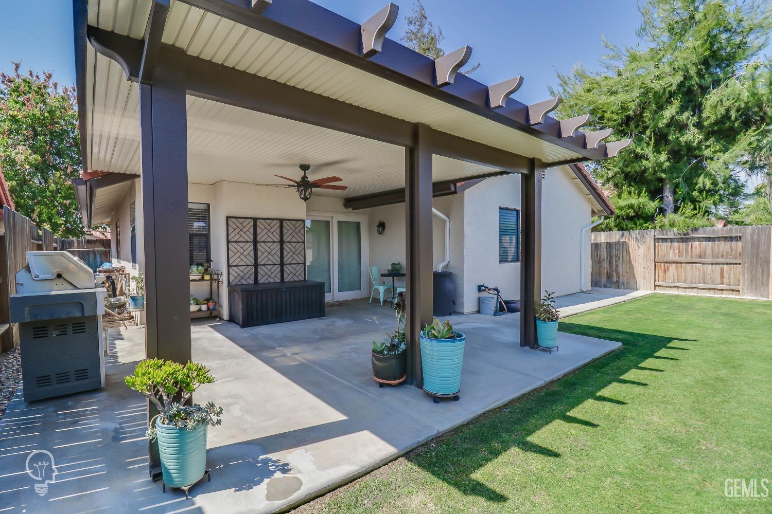 Undisclosed Address Bakersfield, CA 93311 - Photo 14 of 19 a view of a house with backyard of the house
