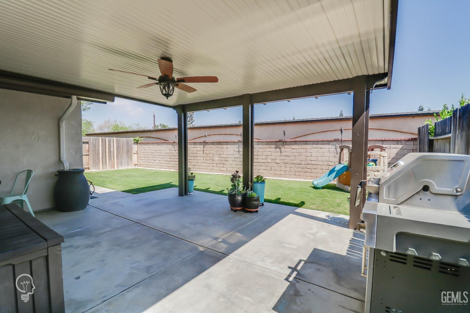Undisclosed Address Bakersfield, CA 93311 - Photo 15 of 19 a living room with patio