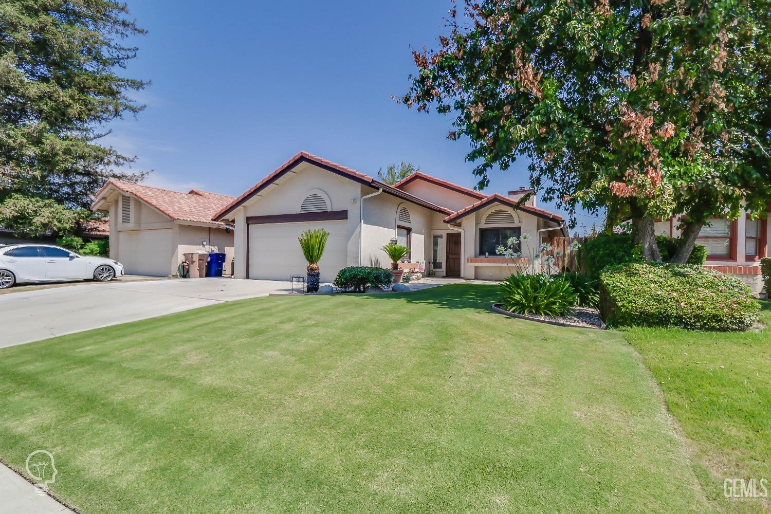 Undisclosed Address Bakersfield, CA 93311 - Photo 3 of 19 a front view of house with yard and green space