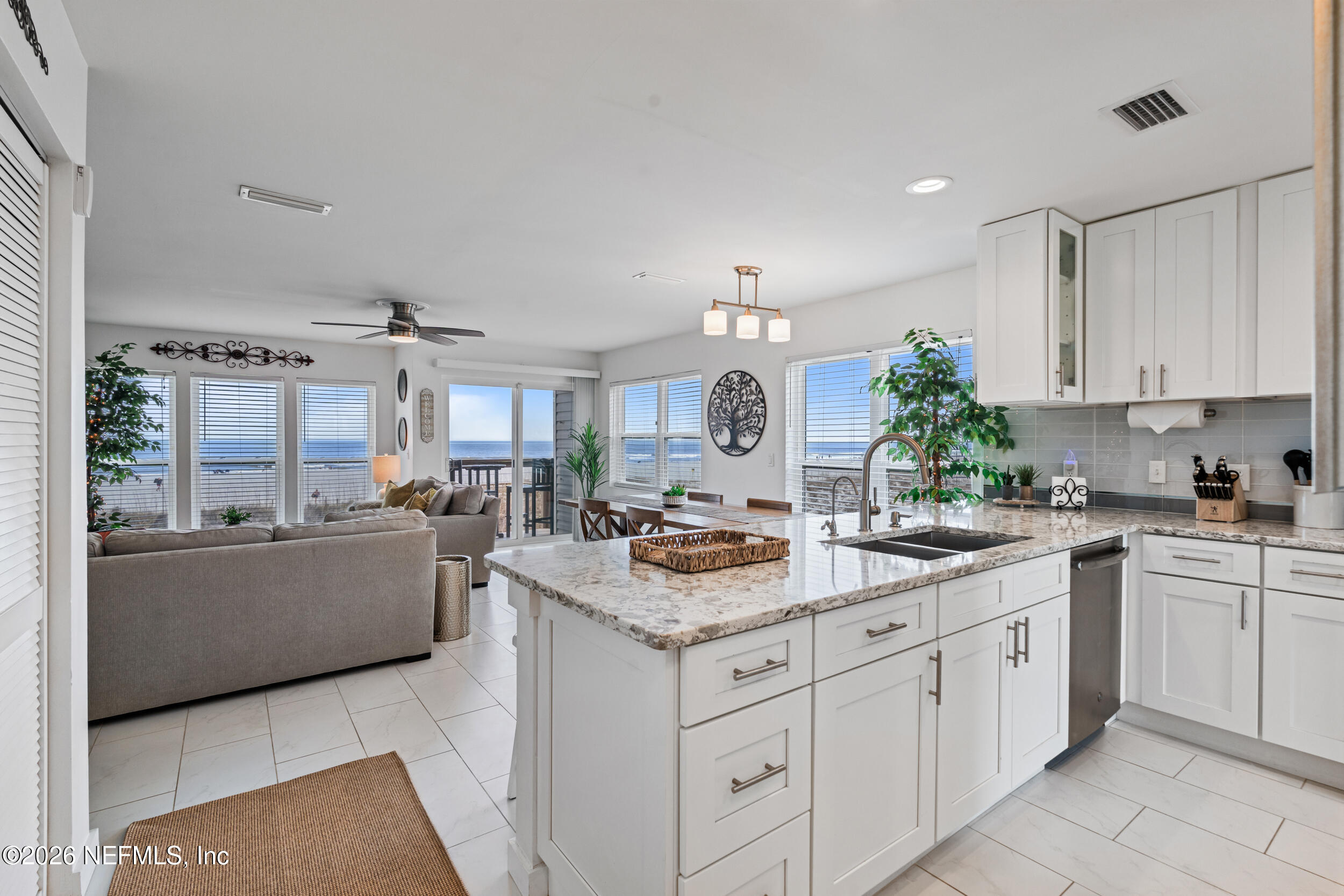 a kitchen with cabinets and window