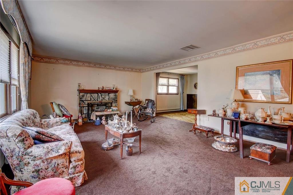 139 East Cliff Road Colonia, NJ 07067 - Photo 2 of 24 a living room with furniture and a wooden floor