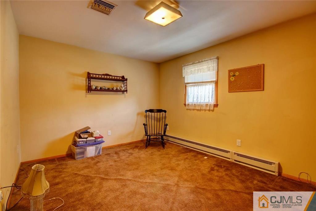 139 East Cliff Road Colonia, NJ 07067 - Photo 11 of 24 a room with gym equipment and a window