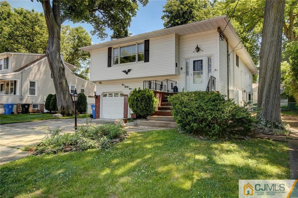 139 East Cliff Road Colonia, NJ 07067 - Photo 18 of 24 a house that has a tree in front of the house